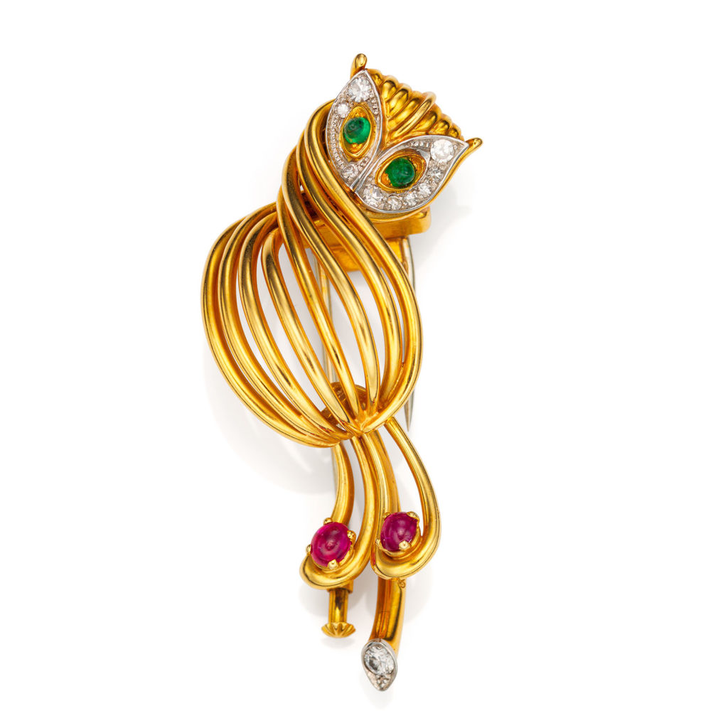 A HISTORICALLY IMPORTANT PATEK PHILIPPE YELLOW GOLD OWL BROOCH