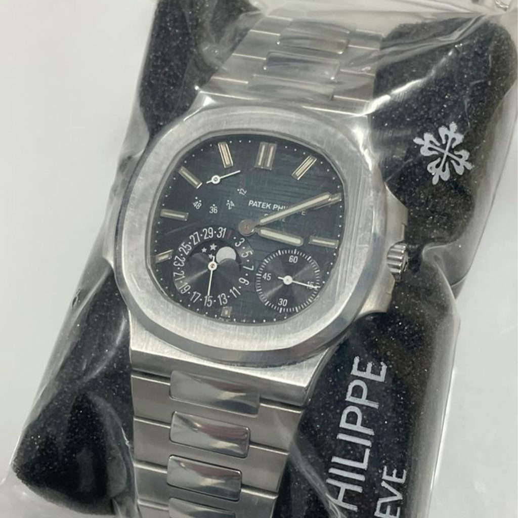 PATEK PHILIPPE STEEL NAUTILUS WITH MOON PHASE AND POWER RESERVE, REF. 5712/1A