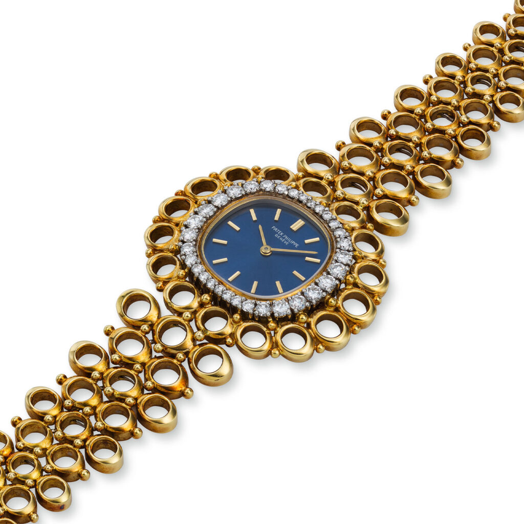 PATEK PHILIPPE YELLOW GOLD AND DIAMOND LADIES BRACELET WATCH REF. 4128/1J