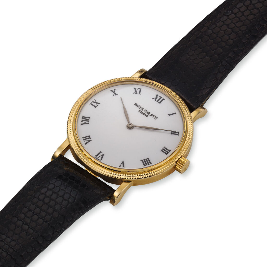 THE 'AMERICAN PIE' PATEK PHILIPPE YELLOW GOLD SELF-WINDING HOBNAIL CALATRAVA, REF. 3992J