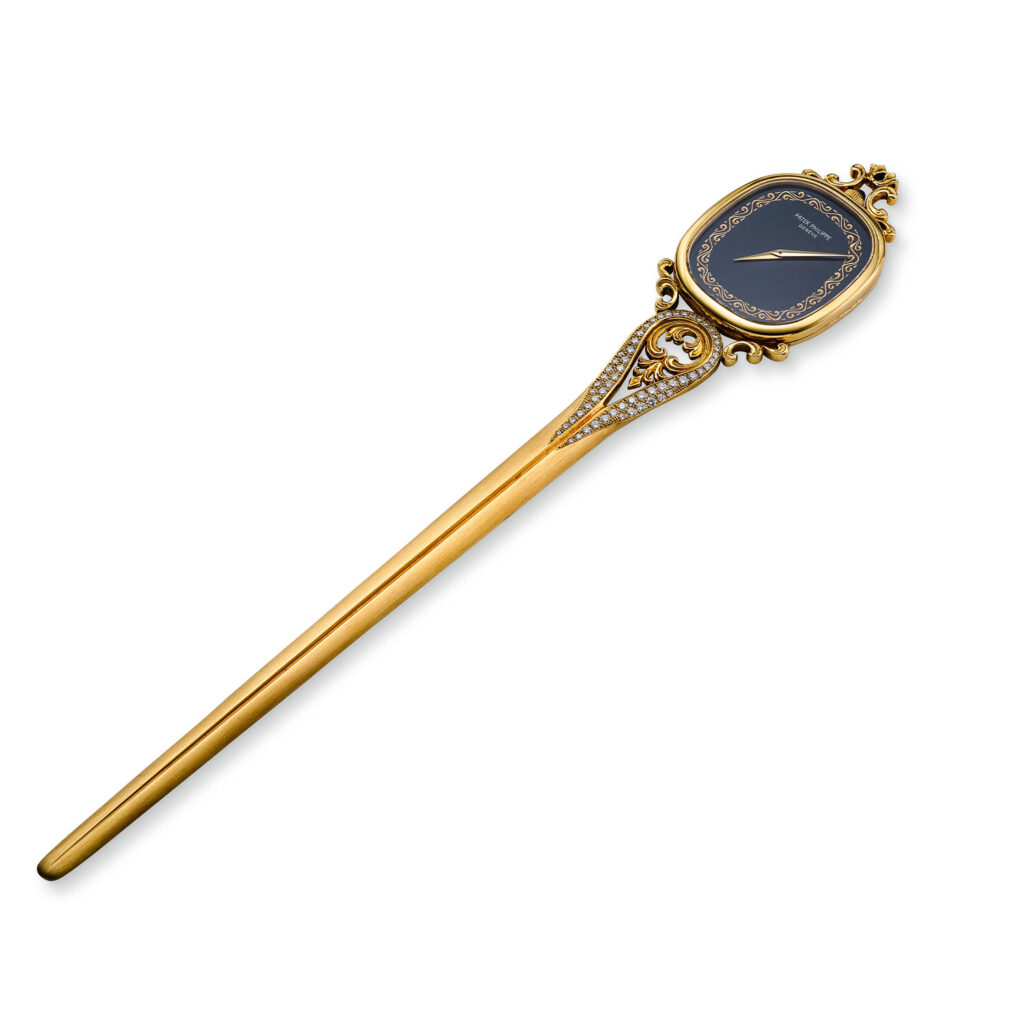 PATEK PHILIPPE YELLOW GOLD AND DIAMOND ELLIPSE LETTER OPENER REF. 913J