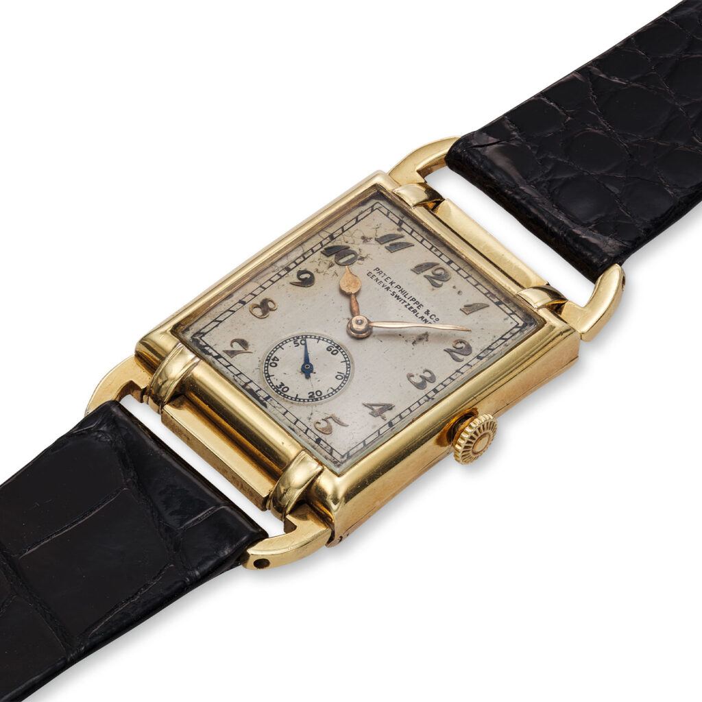 PATEK PHILIPPE YELLOW GOLD RECTANGULAR WRISTWATCH WITH MOVABLE LUGS