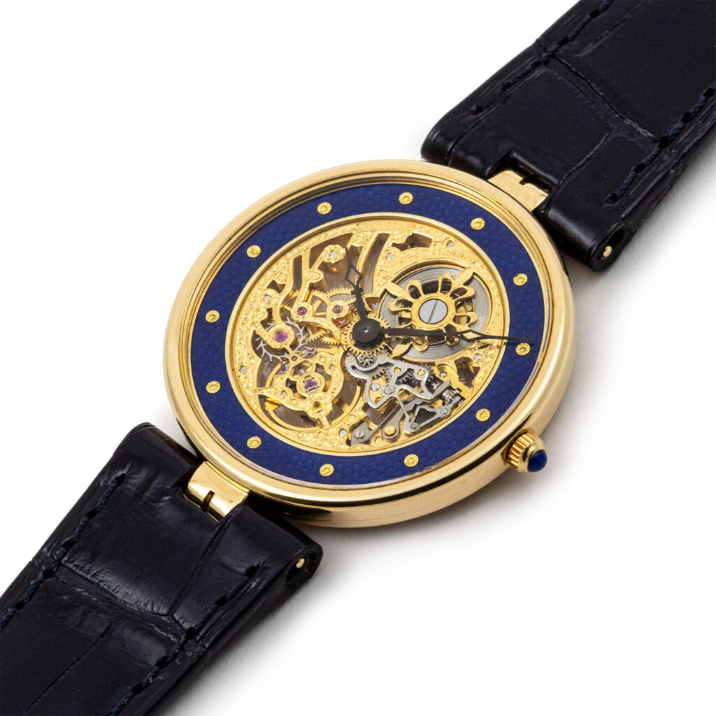 PATEK PHILIPPE GOLD AND BLUE ENAMEL MANUAL SKELETON REF. 3885J