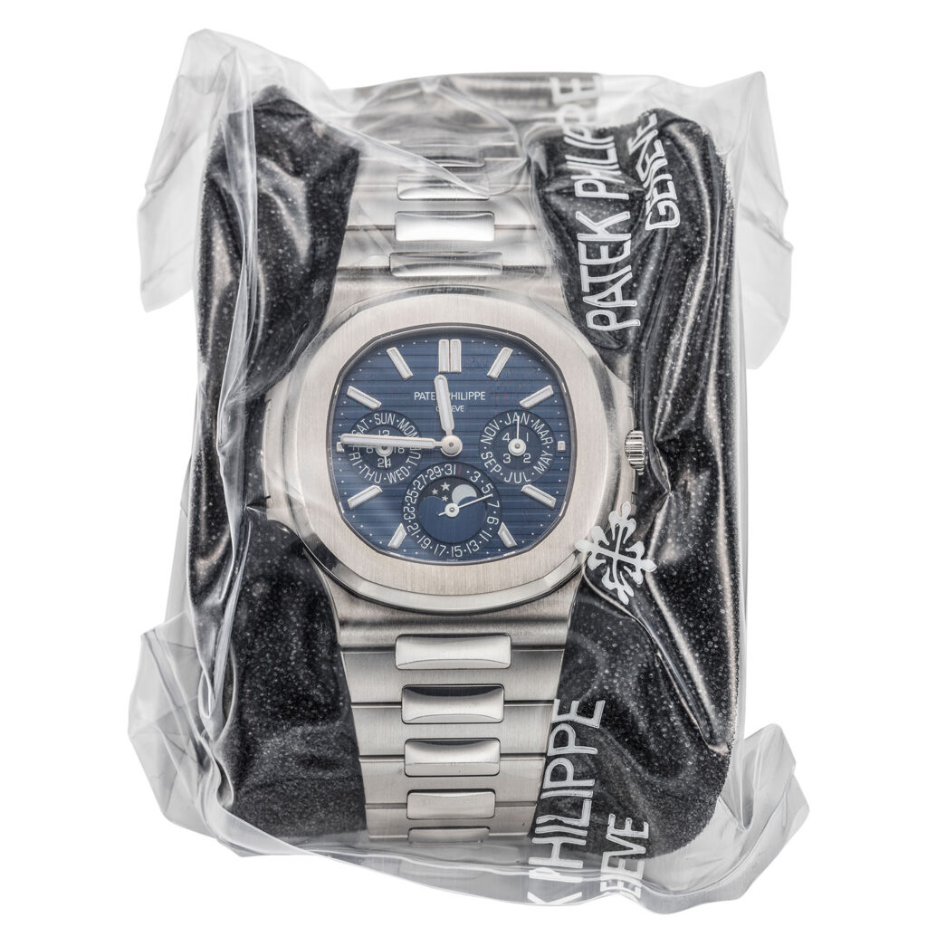 FACTORY SEALED PATEK PHILIPPE WHITE GOLD NAUTILUS WITH PERPETUAL CALENDAR REF. 5740/1G WITH BOX AND PAPERS