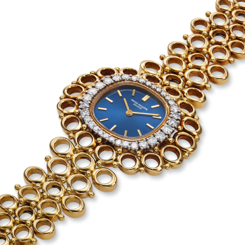 PATEK PHILIPPE YELLOW GOLD AND DIAMOND LADIES BRACELET WATCH REF. 4128/1J