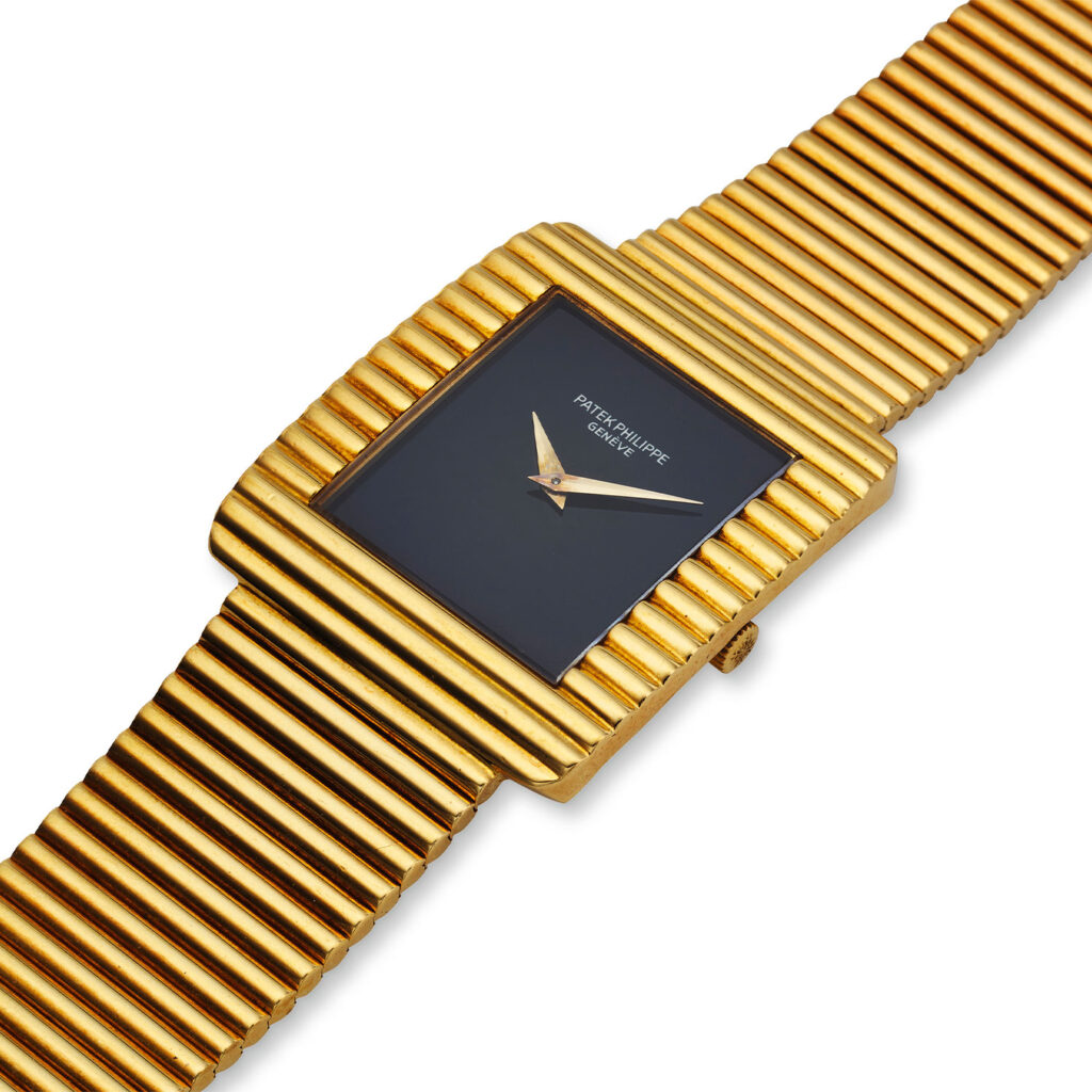 PATEK PHILIPPE YELLOW GOLD AND ONYX BRACELET WATCH REF. 3733/1J