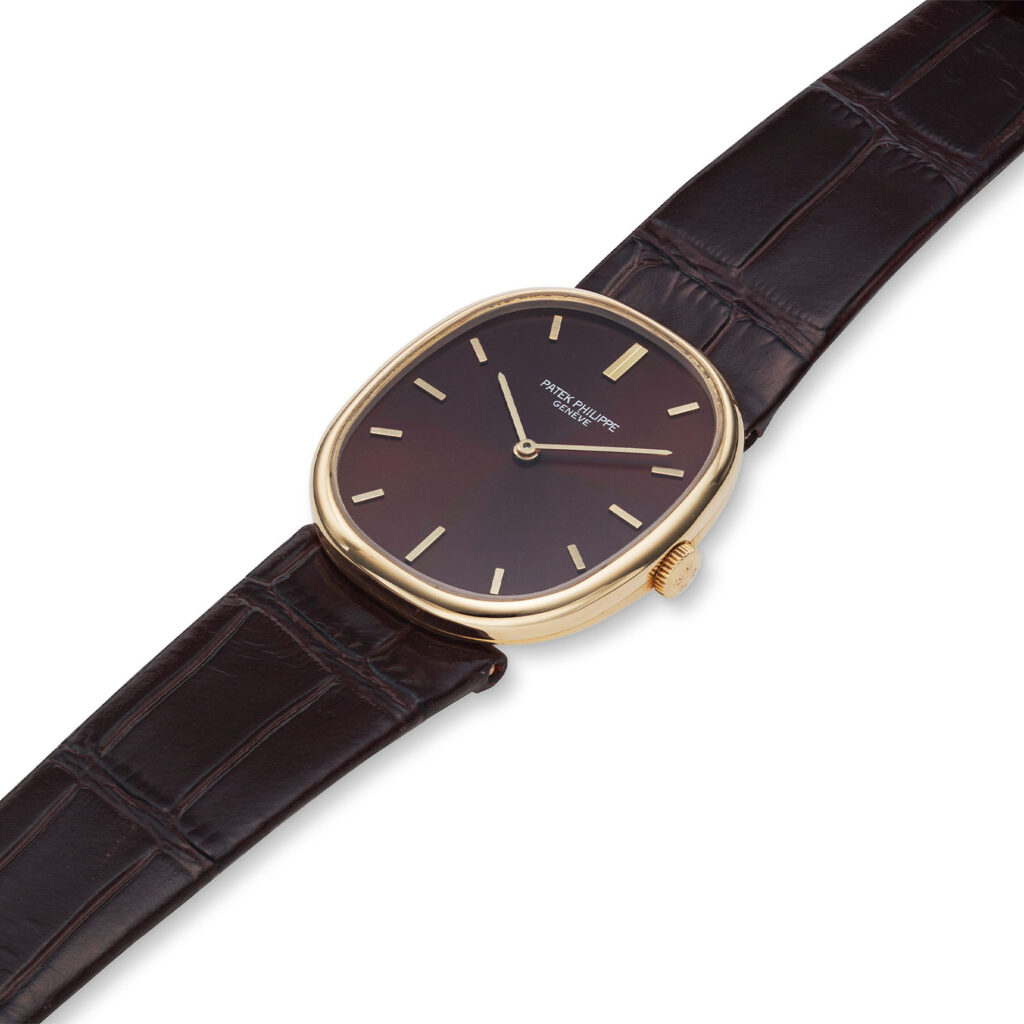 PATEK PHILIPPE YELLOW GOLD ELLIPSE WITH AUTUMN GOLD DIAL