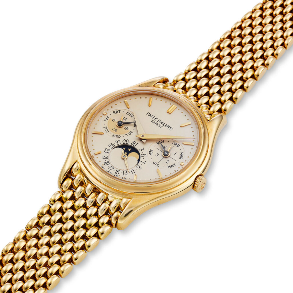 PATEK PHILIPPE PERPETUAL CALENDAR REF. 3940J WITH BRACELET, CIRCA 1990